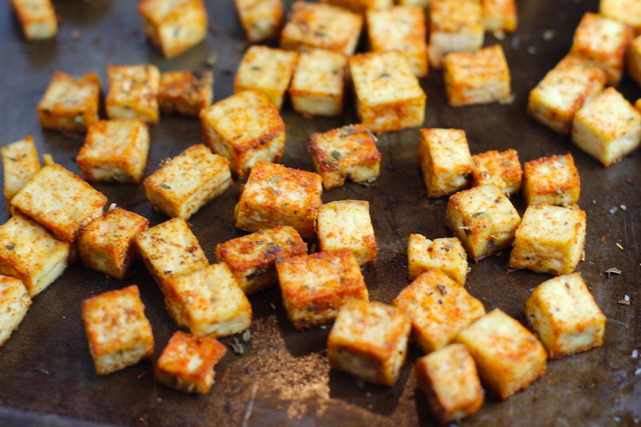 Roasted Tofu Croutons on pan. These are seasoned and toasted for the perfect addition to any salad, pasta, rice, or soup! They get a roasted, almost nutty flavor with a salty and smoky seasoned crust with a chewy bite. Super easy to make, low carb and great source of protein! #croutons #salad #tofu #tofurecipes #vegetarian #plantbased #paleo