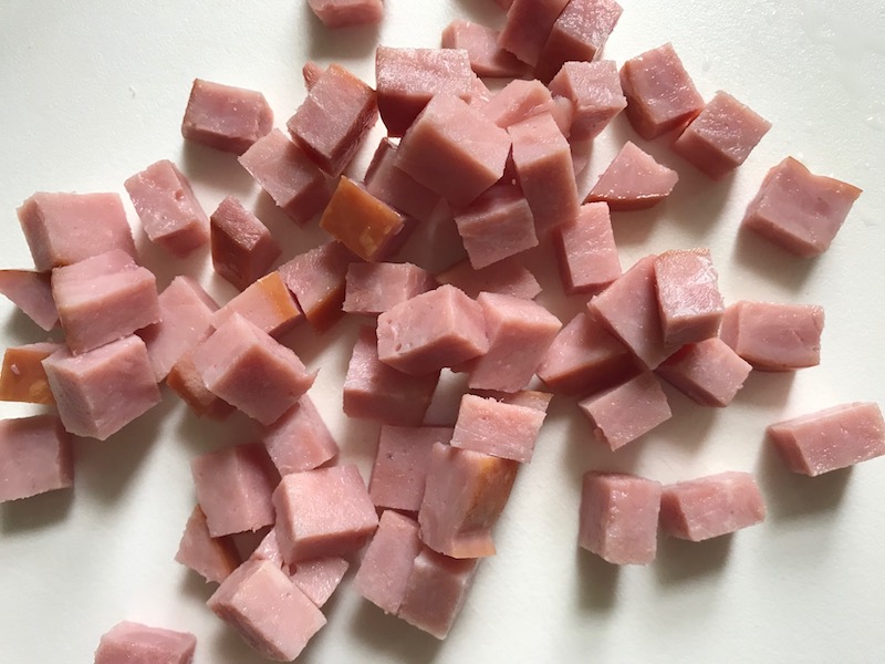 Diced Ham for Cauliflower Cordon Bleu Bake recipe. It layers in nutty and salty Gruyere Cheese, with a creamy Vegetable broth based sauce with garlic and parsley. Then the ham and cauliflower are folded into all of this goodness and it's baked in the oven until it all becomes one knock-your-socks-off dish! #cauliflower #lowcarb #glutenfree #casserole #onepot #familydinner #mealprep #easydinner #dinner #healthydinner #healthyfood #healthyrecipes