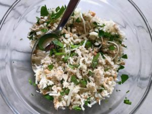 Breadcrumbs, cheese, and parsley topping in bowl for Cauliflower Cordon Bleu Bake recipe. It layers in nutty and salty Gruyere Cheese, with a creamy Vegetable broth based sauce with garlic and parsley. Then the ham and cauliflower are folded into all of this goodness and it's baked in the oven until it all becomes one knock-your-socks-off dish! #cauliflower #lowcarb #glutenfree #casserole #onepot #familydinner #mealprep #easydinner #dinner #healthydinner #healthyfood #healthyrecipes