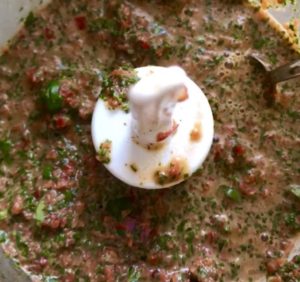 Finished Chimichurri Rojo food processor for the Chicken Chimichurri Rojo. It is broiled or grilled Chicken topped with a cool, fresh, tangy, and incredibly full-flavored! The Rojo comes from the addition of red pepper. All of the ingredients simply get blended in a food processor so it could not be easier! #chicken #chickenrecipes #chimichurri #easychicken #easydinners #dinner