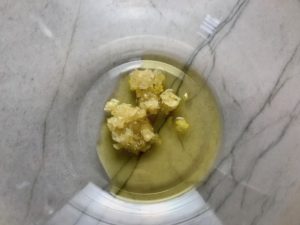 Minced garlic and olive oil in bowl for Garlic and Lime Shrimp with Tzatziki Sauce. The Shrimp is simply sauteed with minced garlic, olive oil, and lemon for big bold flavors. The Tzatziki Sauce is bright and cool with creamy yogurt with fresh cucumber, lime, garlic, and scallion. #shrimp #easydinner #dinner #seafoodrecipes #shrimprecipes