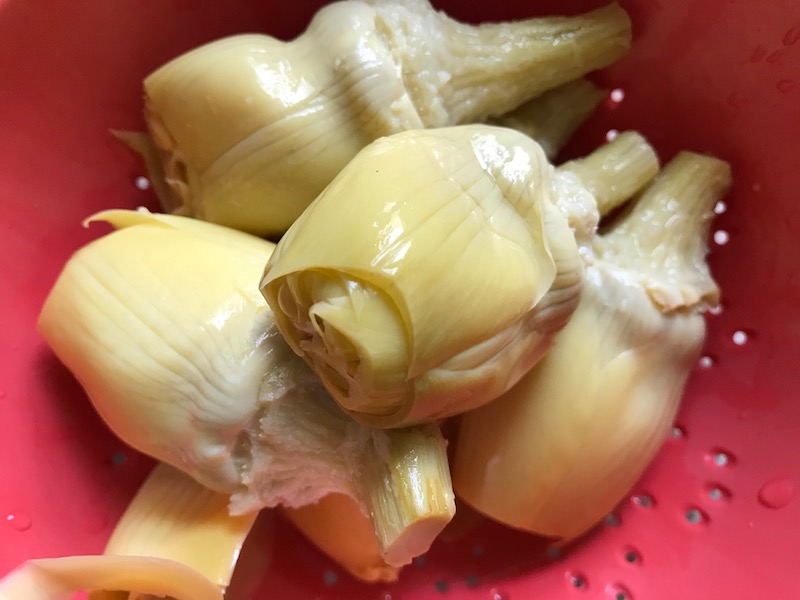 Artichoke hearts for Artichoke Spinach Stuffed Zucchini Recipe. Each fantastic bite gives you creamy artichoke, nutty cheesy Parmesan, spinach, and zucchini. Prepare entirely ahead, then bake 20 minutes and enjoy! #vegetarian #zucchini #stuffedzuchini #spinach #artichoke #springrecipes #healthyfood #healthydinner #healthyrecipes #glutenfree