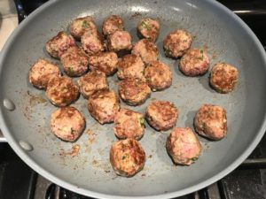 Cooked meatballs in skillet for Meatballs in Cauliflower Dill Cream Sauce. #meatballs #swedishmeatballs #familydinner #easydinner #dinner #healthydinner