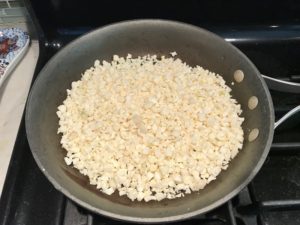 Cauliflower Chopped and in a large skillet for Meatballs in Cauliflower Dill Cream Sauce. The cauliflower sauce with garlic, fresh dill, cream cheese, and tomato paste. #meatballs #swedishmeatballs #familydinner #easydinner #dinner #healthydinner