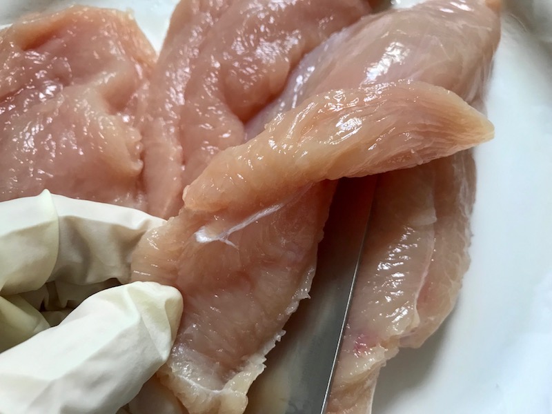 Raw Asparagus on counter for Lemon Dill Sauce Chicken and Asparagus. It has chicken in a light and creamy sauce flavored with garlic, lemon and fresh dill. It's loaded with fresh asparagus. #springrecipes #dinner #easydinner #healthydinner #lemon #asparagus #chicken #glutenfree #easyrecipes