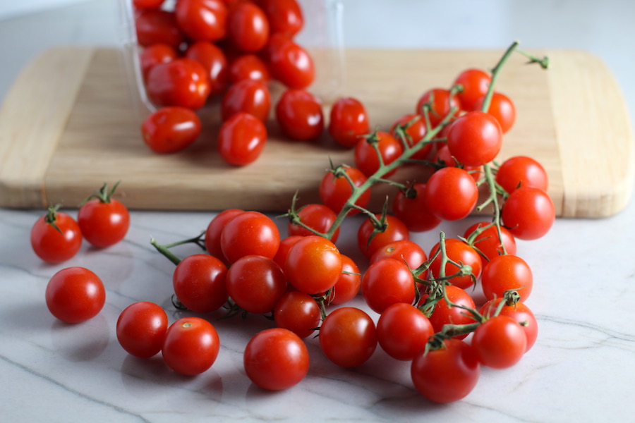 Grape and Cherry tomatoes on vine for Chicken and Cherry Tomato Pasta with basil and parmesan. It's easy and so delicious! #pasta #tomatoes #easydinner #dinner #easyrecipes #healthydinner #chicken