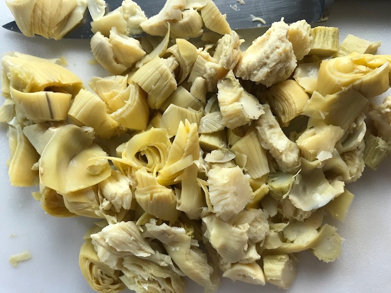Chopped artichoke hearts for Skillet Artichoke Chicken with sun dried tomatoes, basil, garlic, in cream sauce. #skilletchicken #skilletdinner #chicken #easydinner #familydinner #italian #tuscanchicken