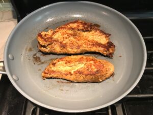 Marinated Mexican Chicken cooking in skillet. This marinade is an easy, make-ahead, and delicious recipe! The chicken is infused with so much smokey, savory flavors from the fresh garlic, chili powder, and cumin. #marinade #chicken #easydinners