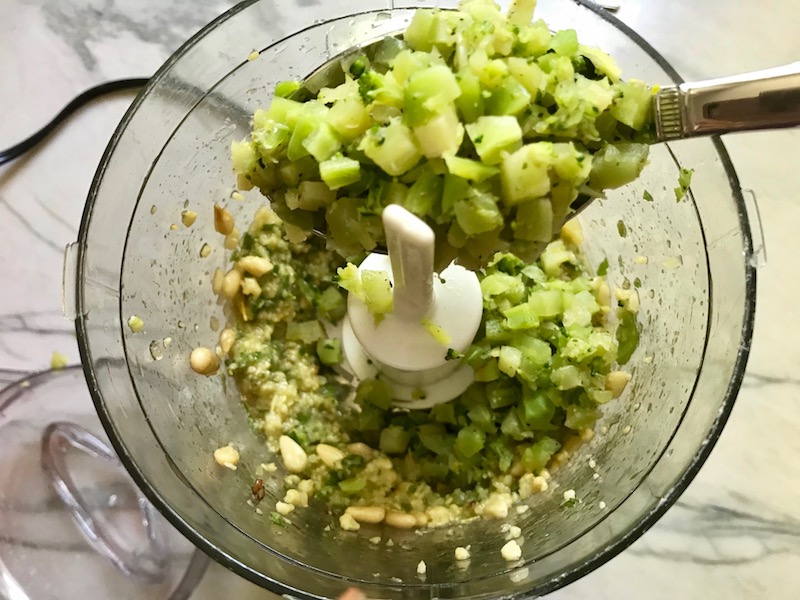 Broccoli added to Basil, Pine nuts, garlic blended in mini food processor for Broccoli Pesto Pasta. It's delicious AND good for you! It has all of the classic pesto flavors from garlic, basil, parmesan cheese, and pine nuts. But the flavor is a bit more mellow by adding broccoli! #broccolirecipes #pesto #pasta #easydinner #dinnerideas #familydinner