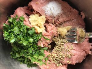 Ingredients in a bowl for homemade Italian Sausage. This Easy ITalian Sausage Chicken Lasagna Recipe is the stuff that dreams are made of. Layers of pasta, creamy ricotta, salty chewy mozzarella, salty and hearty Italian Sausage, and sweet and tangy tomato sauce.