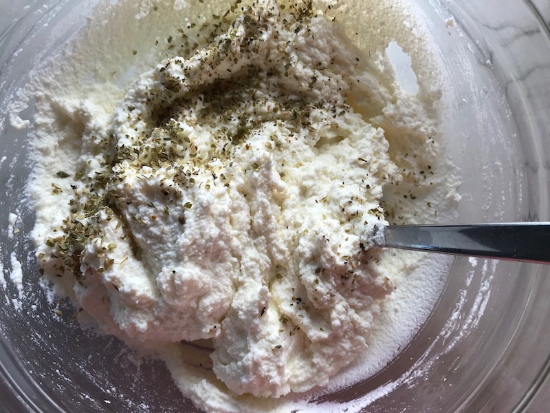 Adding seasoning to Ricotta for Easy Italian Sausage Lasagne Recipe. It's the stuff that dreams are made of. Layers of pasta, creamy ricotta, salty chewy mozzarella, salty and hearty Italian Sausage, and sweet and tangy tomato sauce.