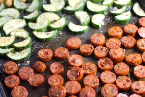 Mediterranean SHEET PAN DINNER with chicken sausage, parmesan zucchini. and crispy chickpeas. Serve over quinoa with dollops of seasoned Ricotta. #sheetpandinner #chickpeas
