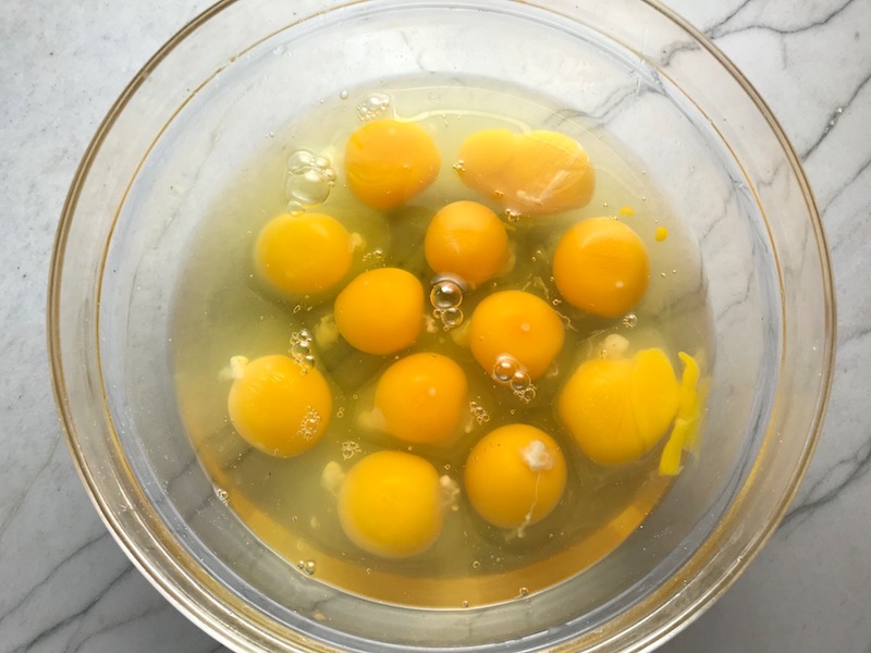 12 eggs in bowl for Slow Cooker Egg Casserole with Chorizo, Potatoes and both cheddar and manchego cheeses. IT COOKS WHILE YOU SLEEP! #eggs #eggcasseroles #eggrecipes #breakfastideas #holidayrecipes