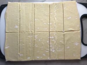 Puff Pastry sheet cut into 10 pieces for Mini Beef Wellington Bites. They are flaky and buttery Puff Pastry is filled with a creamy mushroom and parmesan filling and tender beef filet. #appetizers #partyfood