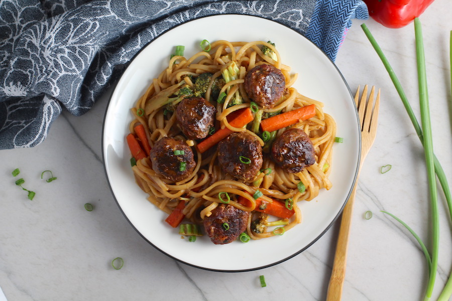 Teriyaki Meatballs with Veggie Stir Fry, and rice noodles on a plate. #asianmeatballs #teriyaki #noodles #familydinner #easydinners #dinnerideas