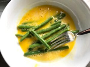 Making Parmesan Green Bean Fries