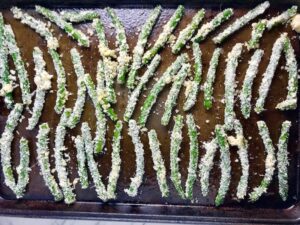 Raw Parmesan Green Bean Fries on sheet pan. Such a great way to transform beans and add a new vegetable into dinner rotation. #vegetablerecipes