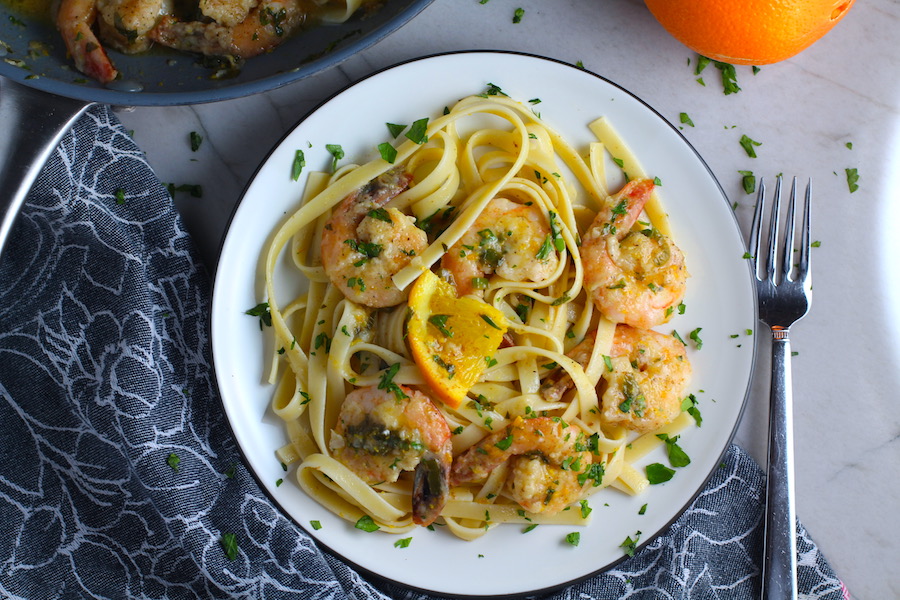 Orange Brown Butter Shrimp Pasta Recipe on a plate. It has a silky sauce that's buttery, nutty, and slightly sweet! #shrimprecipes #shrimppasta #easydinners #dinnerideas