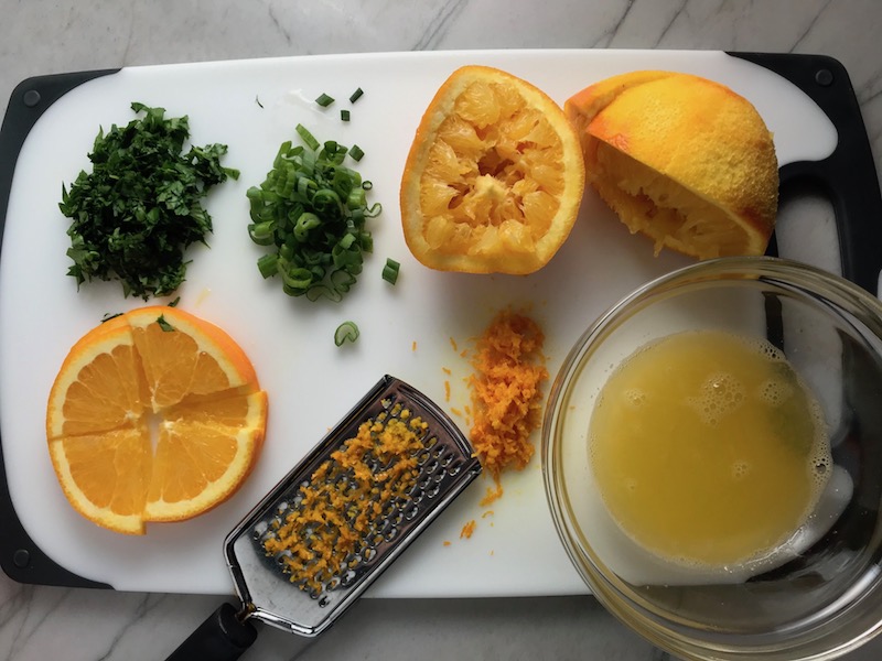 Orange cut, zested, and squeezed for the Orange Brown Butter Shrimp Pasta Recipe. It has a silky sauce that's buttery, nutty, and slightly sweet! #shrimprecipes #shrimppasta #easydinners #dinnerideas
