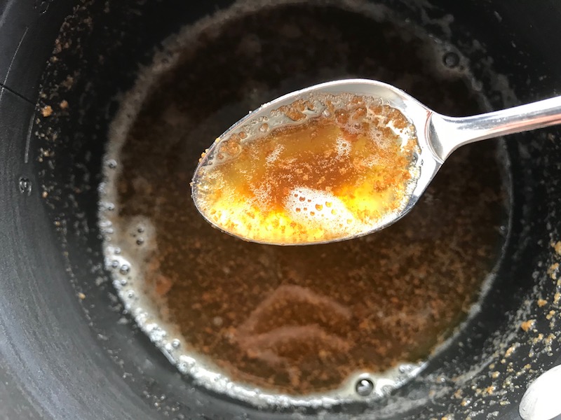 Browned butter in pot for the Orange Brown Butter Shrimp Pasta Recipe. It has a silky sauce that's buttery, nutty, and slightly sweet! #shrimprecipes #shrimppasta #easydinners #dinnerideas