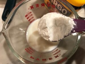 Adding cornstarch to milk for this Heavenly Mushroom Sauce Recipe. #vegetarian #healthydinner #dinnerideas #mushrooms