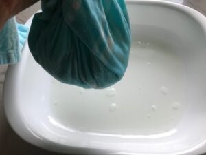 Ringing out cooked cauliflower in dish towel for Cauliflower Gnocchi, which are soft, silky, buttery, and melt-in-your-mouth! Made with cauliflower, they're a healthier version to traditional gnocchi! Add my simple Garlic Butter Sauce or Tomato Sauce and they are heaven.  #dinnerideas #gnocchi #cauliflower