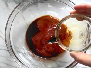 Ketchup, Sweet Chilli Sauce, & Soy Sauce in bowl for Chinese BBQ Sauce for Pork Tenderloin. It's sweet, tangy, salty, and all together lick-your-fingers delicious! It's also easy to make! #chinesebbqsauce #bbq #bbqsauce