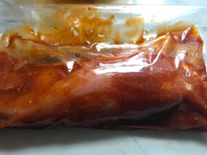 Raw Pork Tenderloin marinating in storage bag for Chinese BBQ Sauce for Pork Tenderloin. It's sweet, tangy, salty, and all together lick-your-fingers delicious! It's also easy to make! #chinesebbqsauce #bbq #bbqsauce