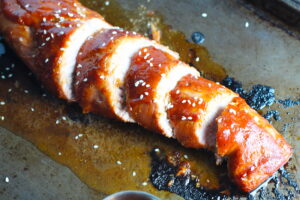 Cooked and sliced Chinese BBQ Pork Tenderloin. It's sweet, tangy, salty, and all together lick-your-fingers delicious! It's also easy to make! #chinesebbqsauce #bbq #bbqsauce