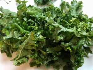 Cleaned & chopped kale for Shell Pasta with Italian Sausage and Kale. It's loaded with a salty homemade Chicken Italian Sausage flavored with garlic and fennel in a parmesan, garlic and kale sauce.