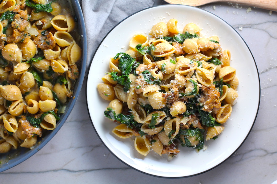 Shell Pasta with Italian Sausage and Kale on a plate. It's loaded with a salty homemade Chicken Italian Sausage flavored with garlic and fennel in a parmesan, garlic and kale sauce.