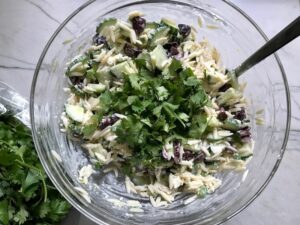 Cilantro added to Greek Orzo Salad with Kalamata Olives, Cucumbers, and Feta Cheese. It's mixed with a creamy lemon dressing that's bright and light!