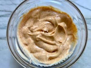 Chipotle Mayonnaise mixed in a clear bowl for Turkey Taco Burger recipe.