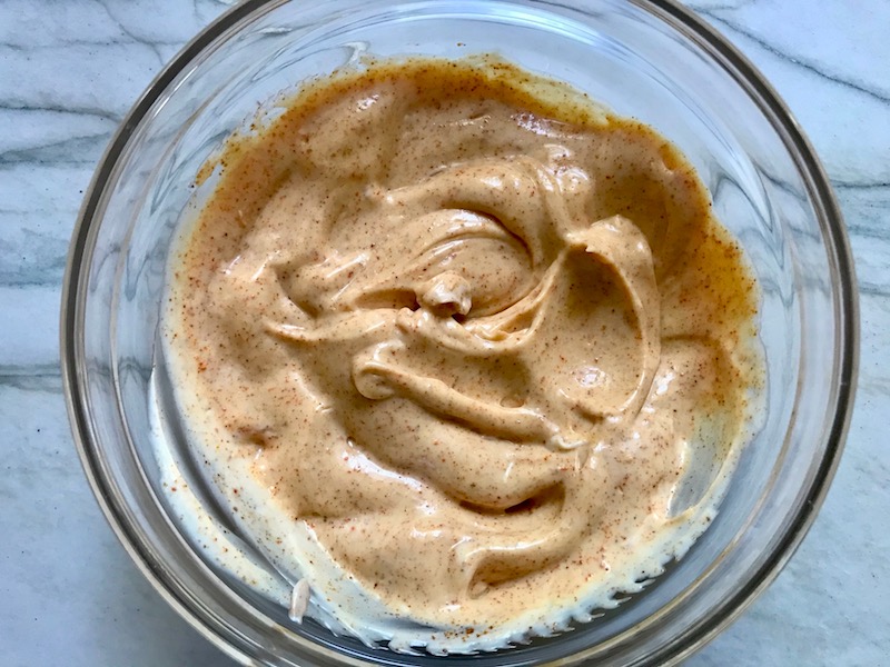 Chipotle Mayonnaise mixed in a clear bowl for Turkey Taco Burger recipe.