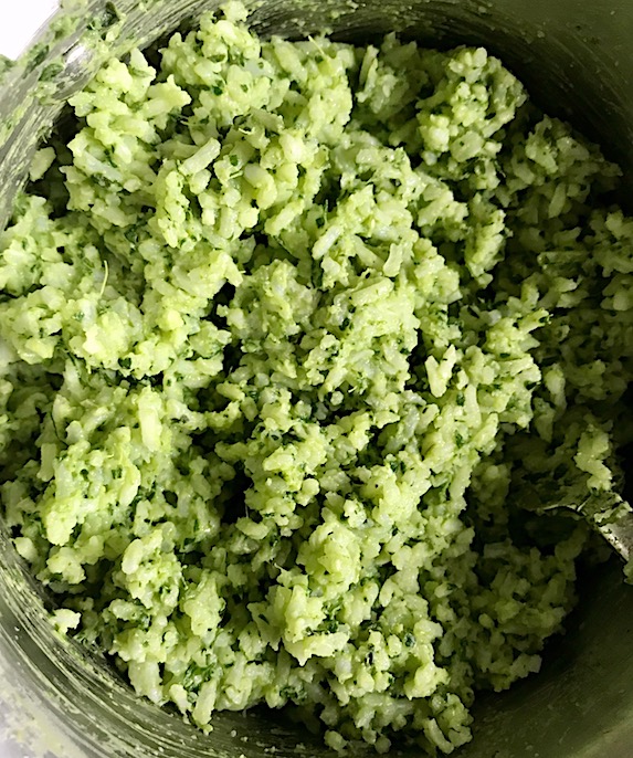 Close Up of green rice in pot. This Green Rice Recipe takes white rice from plain to amazing with just 5 ingredients. Filled with herbs and spinach, it has the perfect herby flavor.