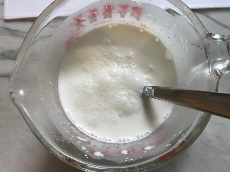 Cornstarch and Milk slurry in cup for Light and Easy Fettuccine Alfredo with Prosciutto