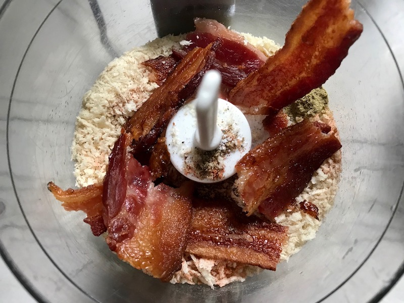Bacon and breadcrumbs in food processor for Oven Fried Chicken Breast. The chicken is coated with Bacon Crumbs and Honey and it's healthier because it's baked, not fried, but still gives you all of the crispy, crunchy goodness! It also gives you sweet and salty crunch with the addition of honey and bacon!