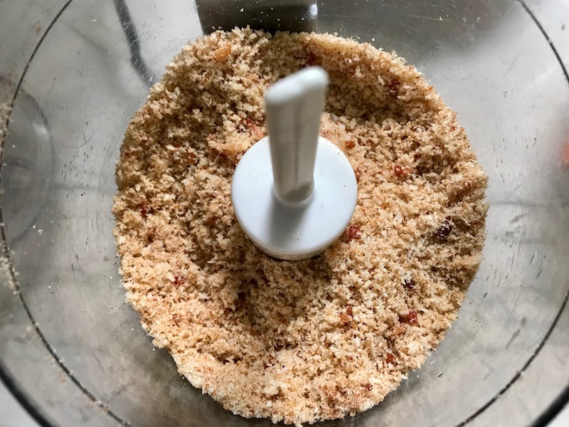 Bacon and breadcrumbs blended in food processor for Oven Fried Chicken Breast. The chicken is coated with Bacon Crumbs and Honey and it's healthier because it's baked, not fried, but still gives you all of the crispy, crunchy goodness! It also gives you sweet and salty crunch with the addition of honey and bacon!