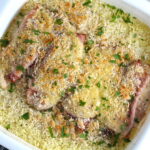 Chicken Cordon Bleu and Rice Casserole in casserole dish.  On the bottom you get flavorful rice topped with chicken, salty ham, nutty and melty swiss cheese, and a crunchy breadcrumb topping!