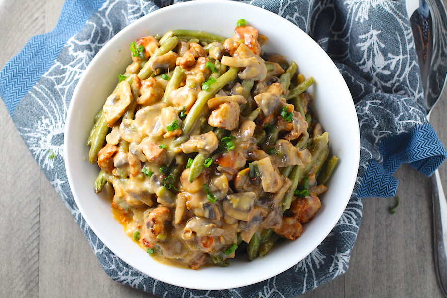 Creamy Green Beans and Mushrooms with Chorizo in a serving bowl are a creamy and savory side dish.