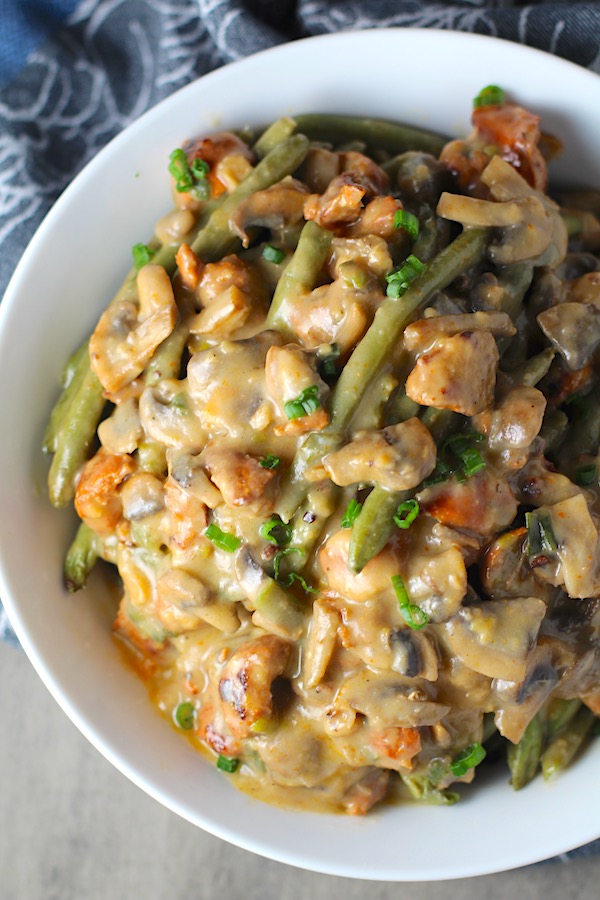 Creamy Green Beans and Mushrooms with Chorizo in a serving bowl are a creamy and savory side dish.