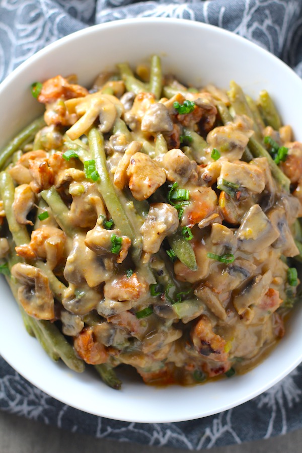 Chorizo Sausage and Green Bean Casserole in a serving bowl are a creamy and savory side dish.