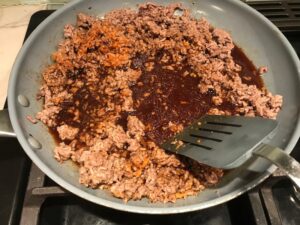 Korean Bulgogi Ground Beef cooked in a skillet for Korean Beef and Rice Bowls.