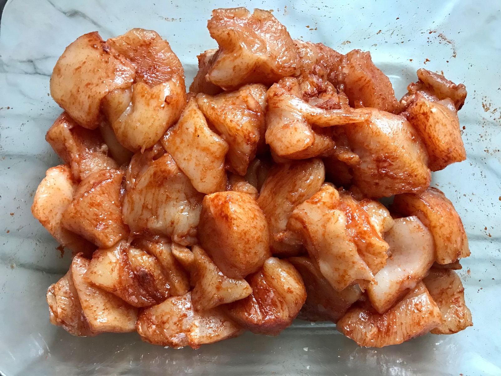 Raw cubed chicken seasoned with paprika for Quick Cooking Creamy Chicken Paprika. It's creamy, smokey, rich, and hearty. This is an easy weeknight family dinner!