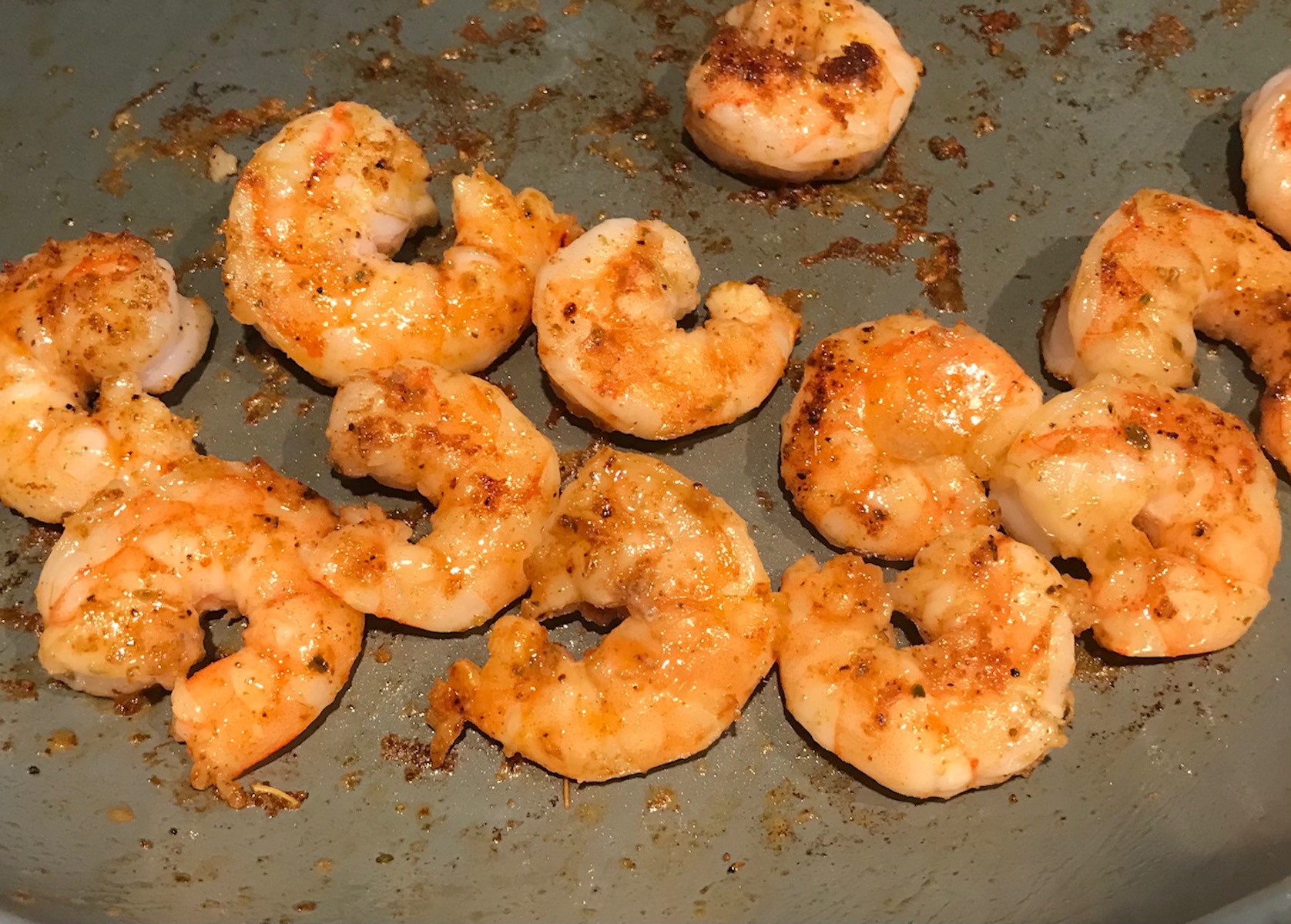 Cajun Shrimp cooking in a pan for Shrimp and Grits recipe.