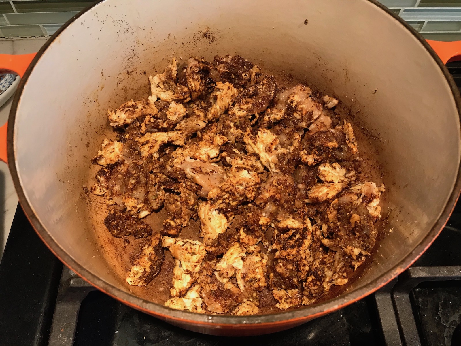 Seasoned ground chicken cooking in pot for Tex Mex Unstuffed Peppers with Ground Chicken. Juicy Sweet Bell Peppers are chopped up and cooked with the Tex Mex style ground chicken, tomatoes, Mexican seasonings, cheese, rice and corn tortillas.