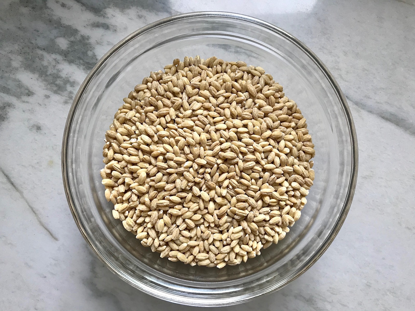 Raw barley in a bowl for Creamy Barley with Bacon recipe.