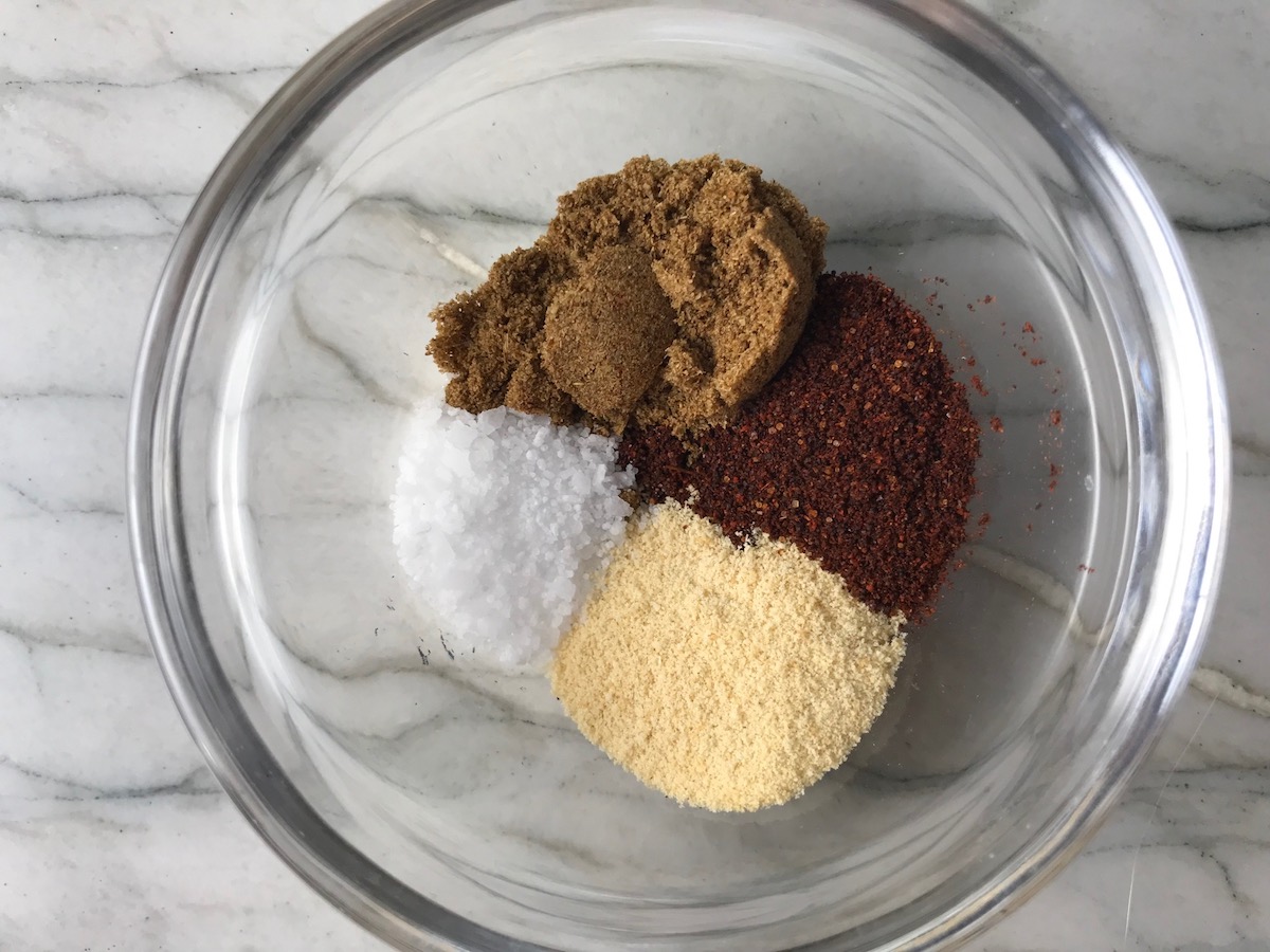 Chili Powder, Ground Cumin, Garlic Powder, and salt in a bowl for Grilled Shrimp Tacos