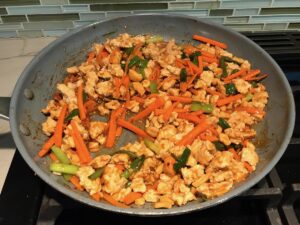 Ground Chicken and carrots cooked in a pan for these Low Carb Chicken Lettuce Wraps.
