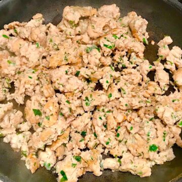 Ground Italian Chicken Sausage cooked in a frying pan.